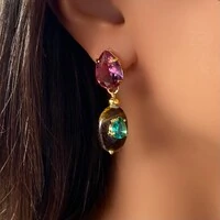 Brinco Olho de Tigre com Zircônia Fucsia