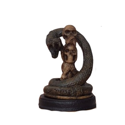 Foto Caveiras Cego Surdo Mudo com Serpente