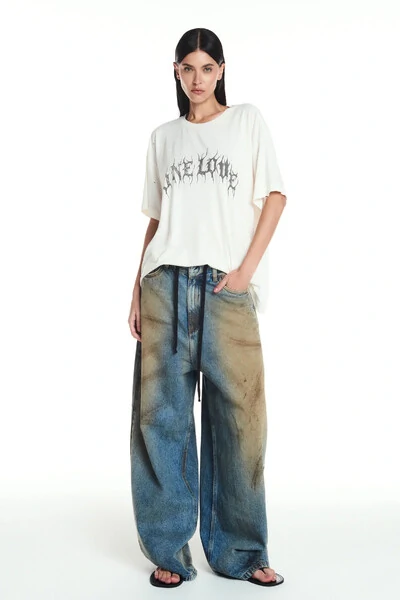 Foto Calça Jeans ballon manchada