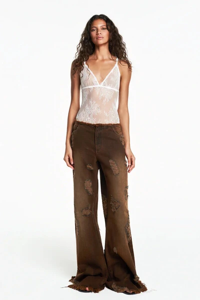 Foto Calça jeans flare rasgos