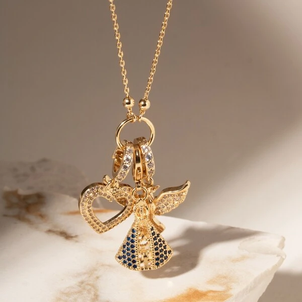 Colar Patuá com Charms Nossa Senhora Aparecida, Divino Espírito Santo e Coração Vazado com Zircônias