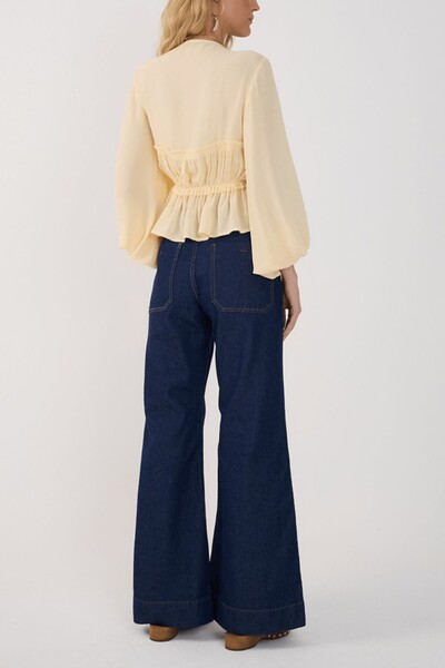 FotoCalça jeans flare bolso Dress to