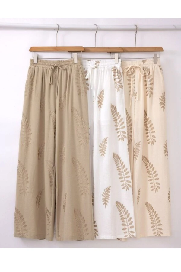Calça feminina bordado folhas Kwi