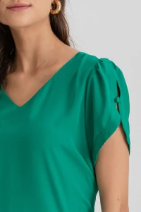 Blusa manga aberta botão forrado