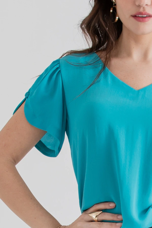 Blusa manga aberta botão forrado