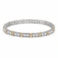 Pulseira bracelete ródio branco riviera com detalhe em x dourado