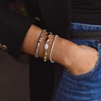 Pulseira dourada ovais lisos e1 oval cravejado zircônia cristal em ródio branco