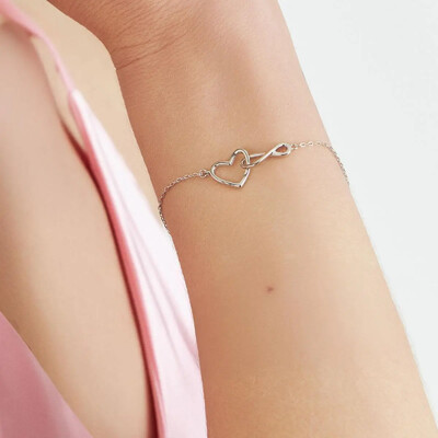 Foto Pulseira prata 925 com pingente coração e símbolo do infinito trançado