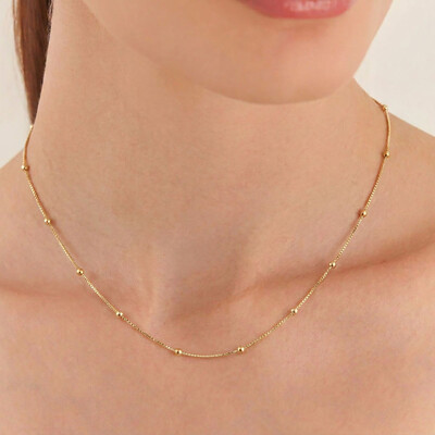 Foto Colar choker dourado esferas intercaladas e lisas