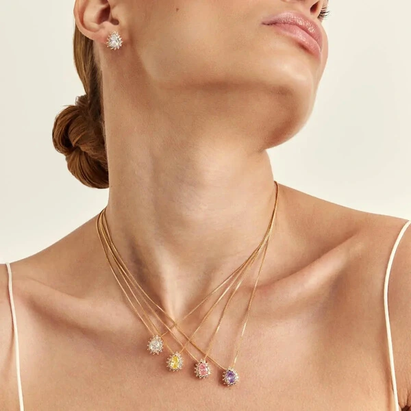 Conjunto dourado oval ametista e zircônias cristal entorno