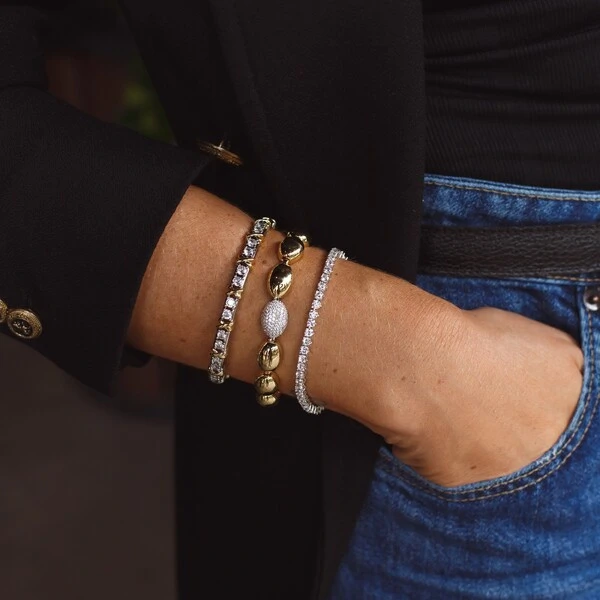 Pulseira bracelete ródio branco riviera com detalhe em x dourado
