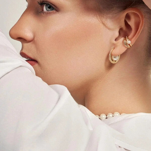 Piercing dourado pérola shell, trançado zircônia