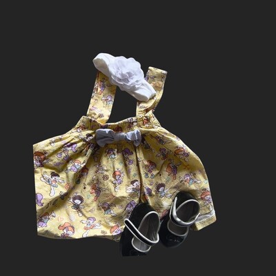 Foto Saia Infantil Amarela Plissada de suspensório Estampada