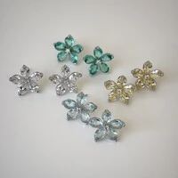 Brinco Lótus zircônias água marinha ródio branco