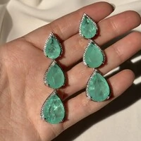 Brinco Malibu esmeralda colombiana fusion ródio branco