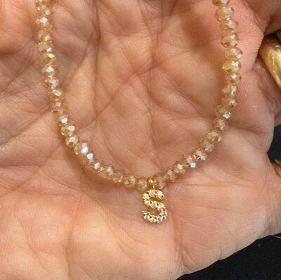 Foto Colar Cristal Dourado com Letra Inicial Cravejada com Zircônias em Dourado