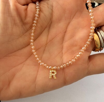 Foto Colar Cristal Dourado com Letra Inicial Cravejada com Zircônias em Dourado