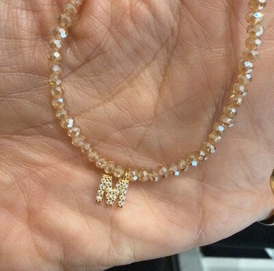 Foto Colar Cristal Dourado com Letra Inicial Cravejada com Zircônias em Dourado