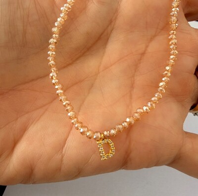 Foto Colar Cristal Dourado com Letra Inicial Cravejada com Zircônias em Dourado