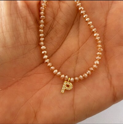 Foto Colar Cristal Dourado com Letra Inicial Cravejada com Zircônias em Dourado