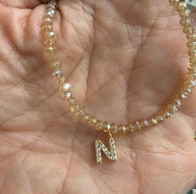 Foto Colar Cristal Dourado com Letra Inicial Cravejada com Zircônias em Dourado
