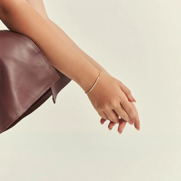 Pulseira Sorriso Cravejada com Zircônias em Dourado