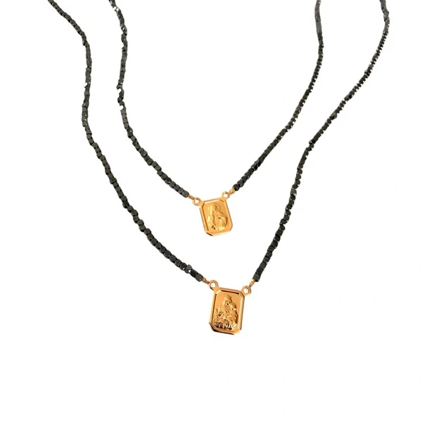 Escapulário Hematita Ping Menino Jesus e N Sra em Dourado