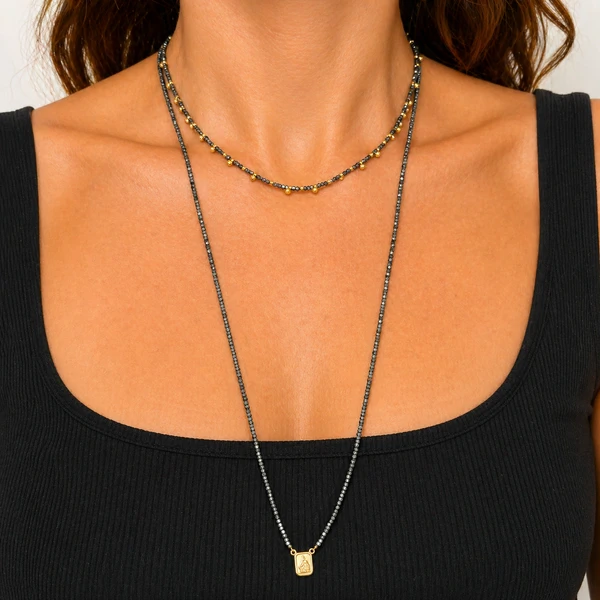 Escapulário Hematita Ping Menino Jesus e N Sra em Dourado