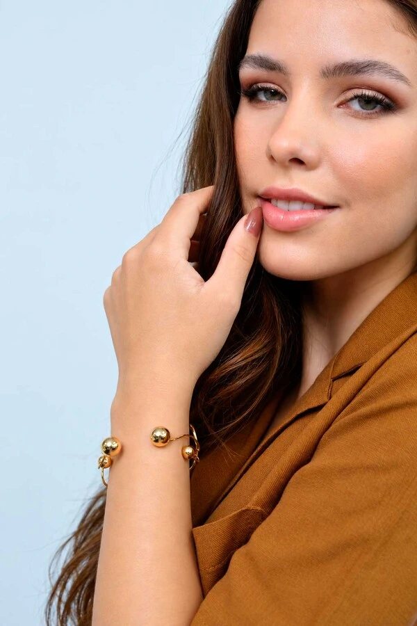 Bracelete Semijoia Essenza Assimétrico Esferas Dourado