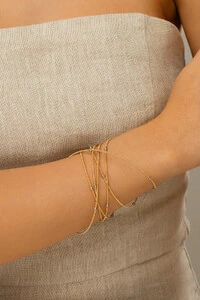 Pulseira Dourada Corda de Violão Bolinhas Prateadas