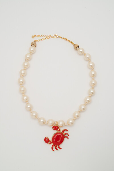 Foto Colar Dourado Crustáceo