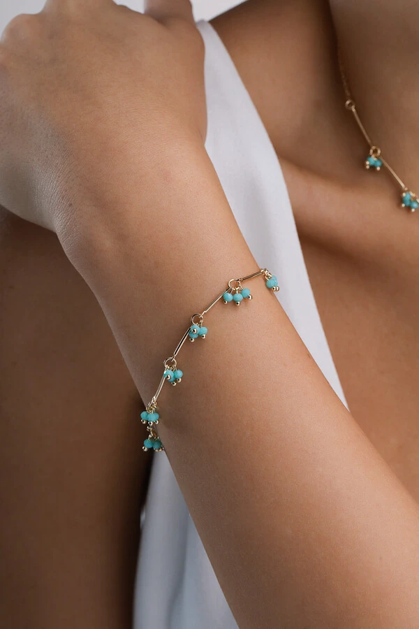 Pulseira Dourada Palitos Cachos Cristal Azul